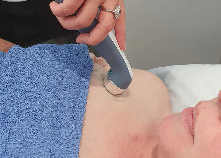 Using an ultrasound machine to treat blocked milk ducts after birth